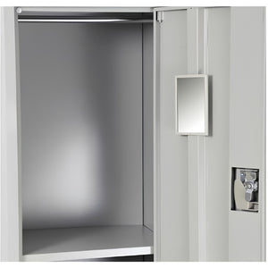 Grey lockable metal locker styled in a home dressing room setting